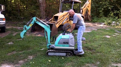 smallest micro digger|stand behind mini excavator.